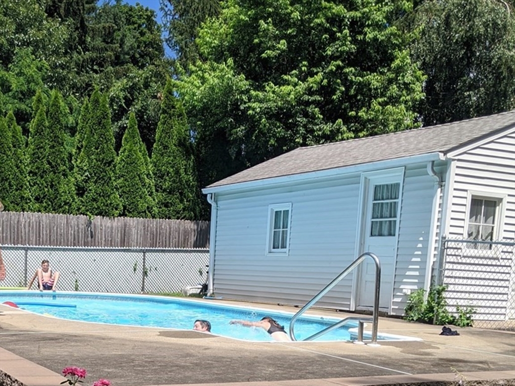 18 Frank Street Chelmsford, MA 01863 - Photo 38 of 38 a front view of a house with a yard