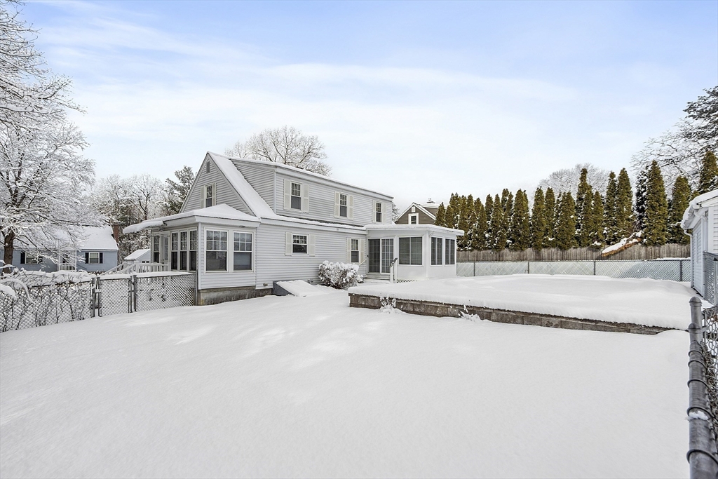 18 Frank Street Chelmsford, MA 01863 - Photo 4 of 38 a front view of a house with a yard