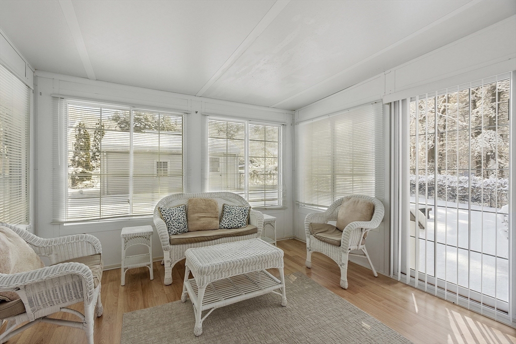 18 Frank Street Chelmsford, MA 01863 - Photo 8 of 38 a living room with furniture and a large window
