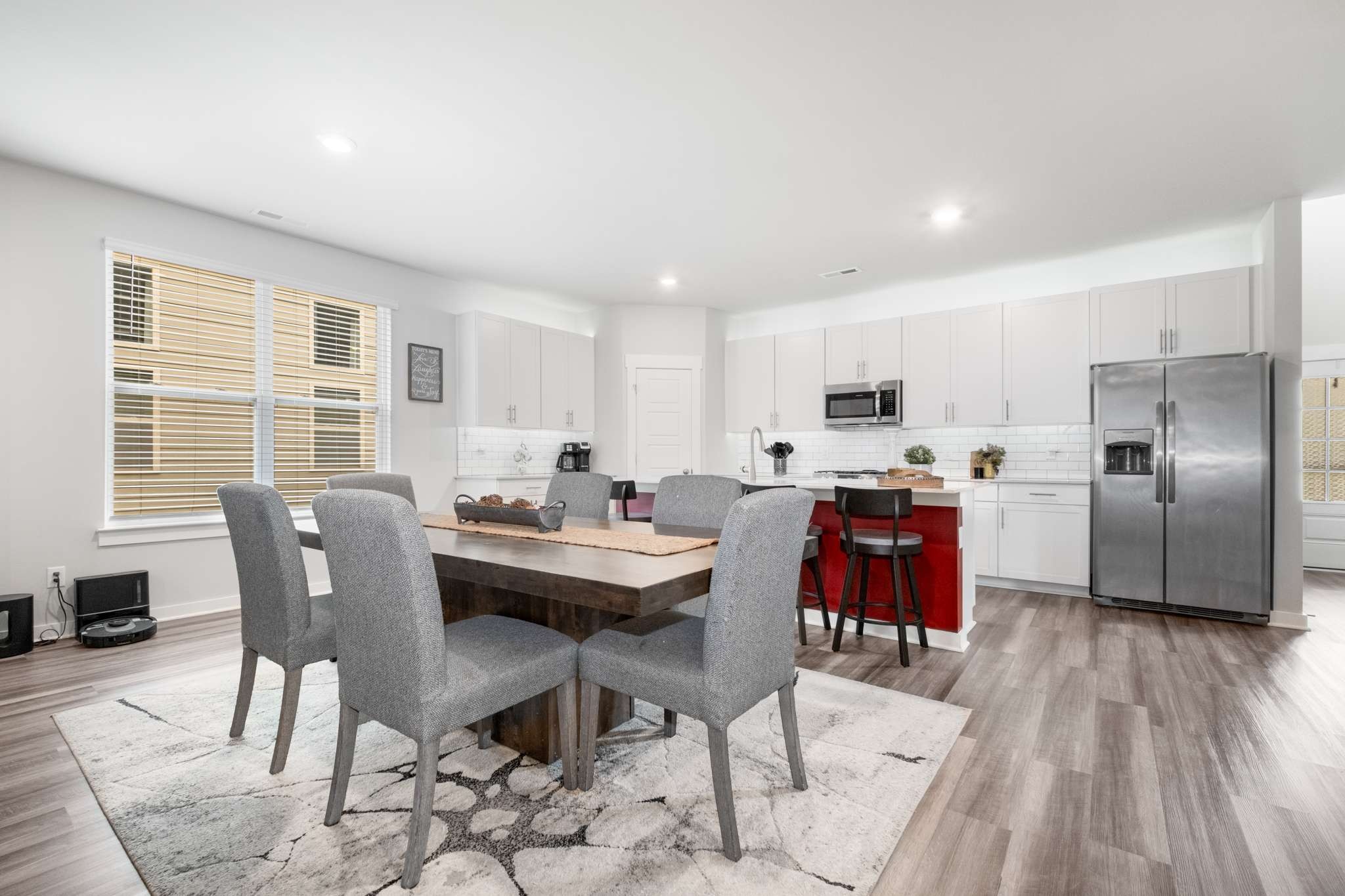 3122 Rift Lane Murfreesboro, TN 37130 - Photo 11 of 55 a kitchen with stainless steel appliances kitchen island granite countertop a dining table chairs and granite counter tops