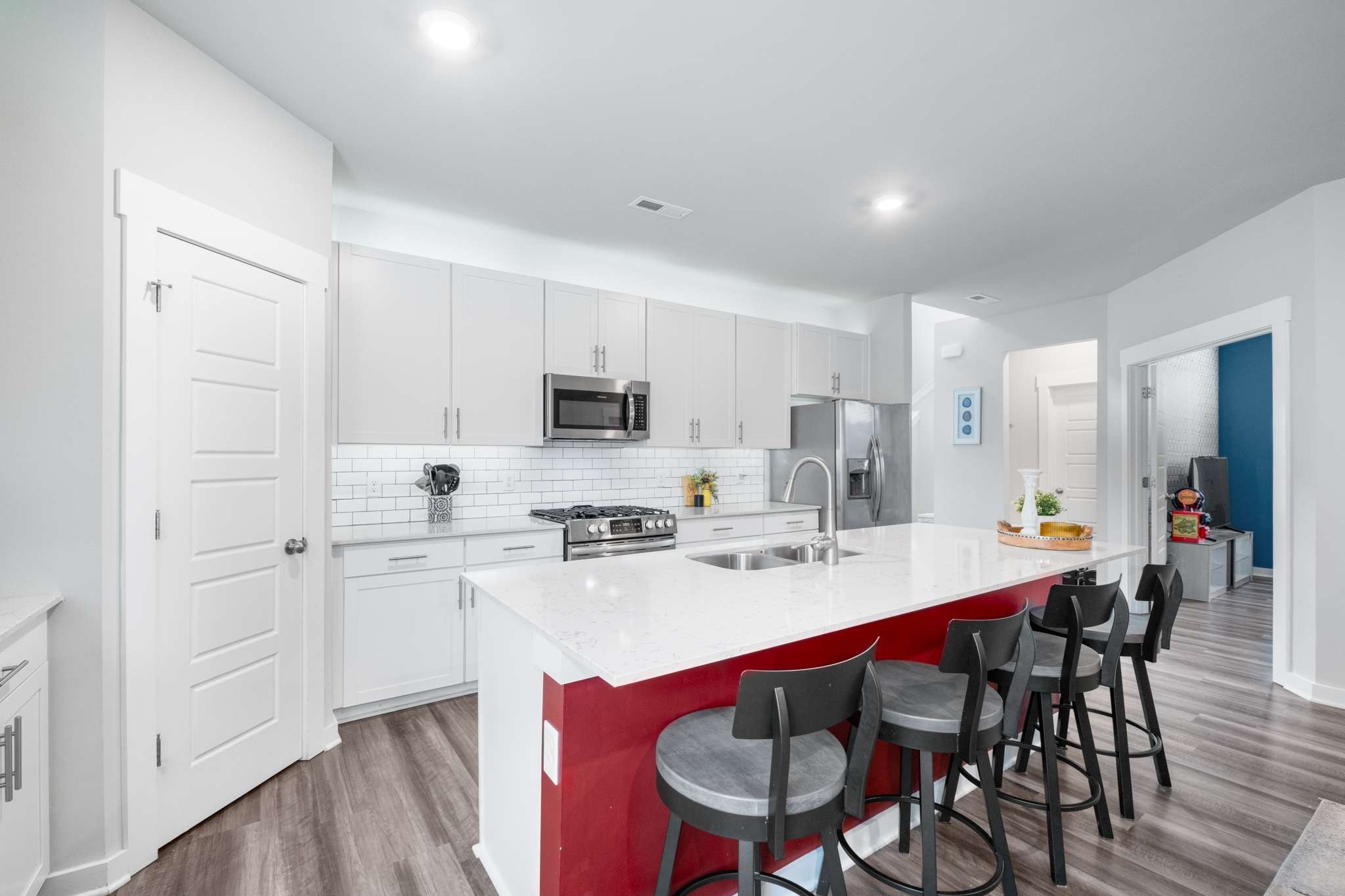 3122 Rift Lane Murfreesboro, TN 37130 - Photo 15 of 55 a kitchen with stainless steel appliances a table chairs refrigerator and cabinets