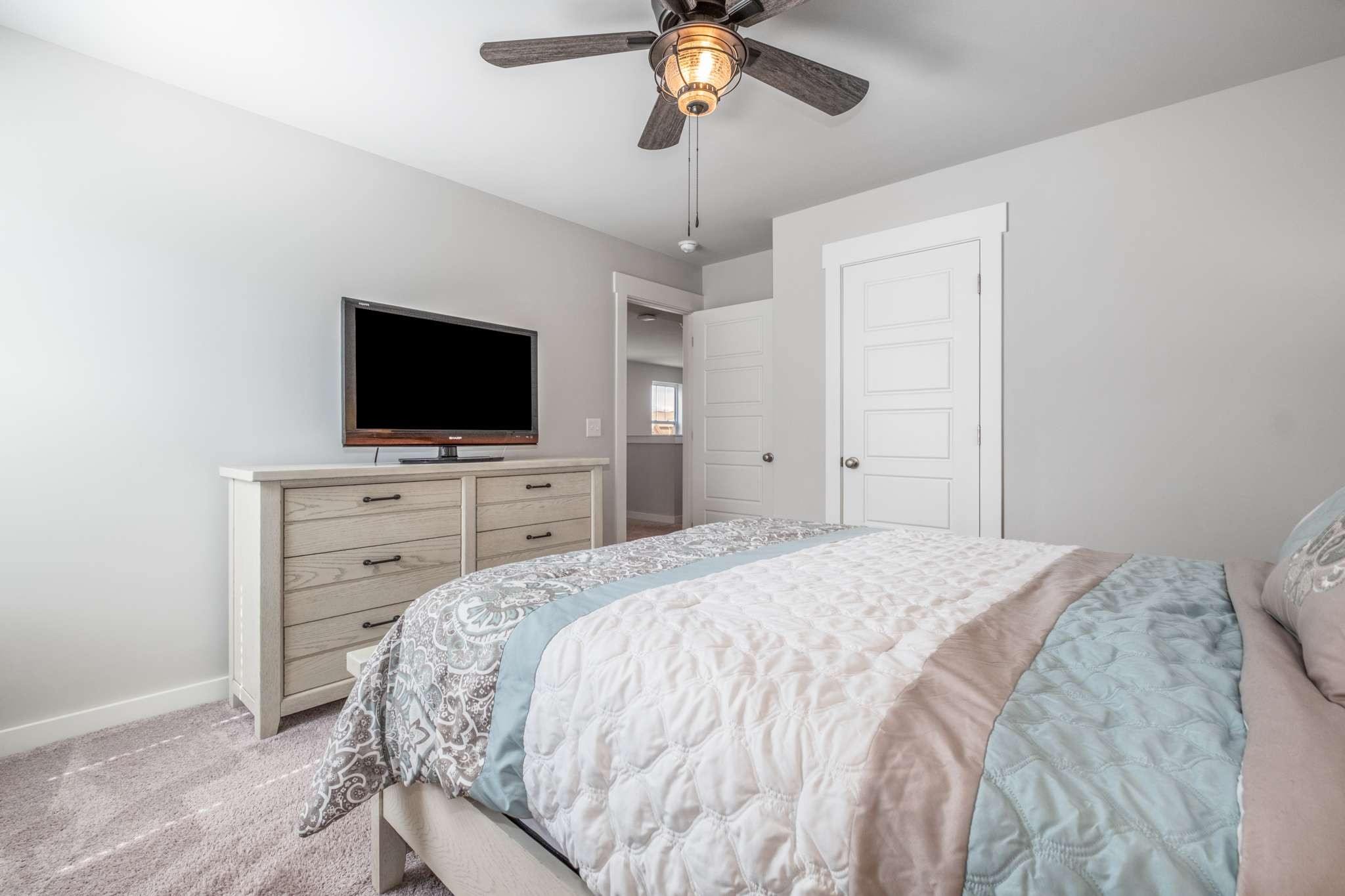 3122 Rift Lane Murfreesboro, TN 37130 - Photo 30 of 55 a bedroom with a bed and a flat tv screen on dresser