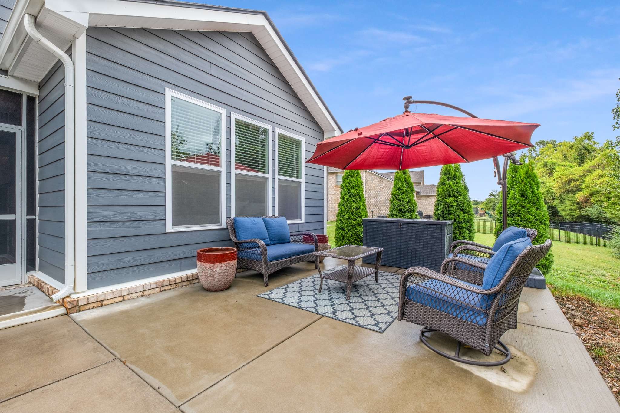 3122 Rift Lane Murfreesboro, TN 37130 - Photo 44 of 55 a view of a patio with a table and chairs under an umbrella