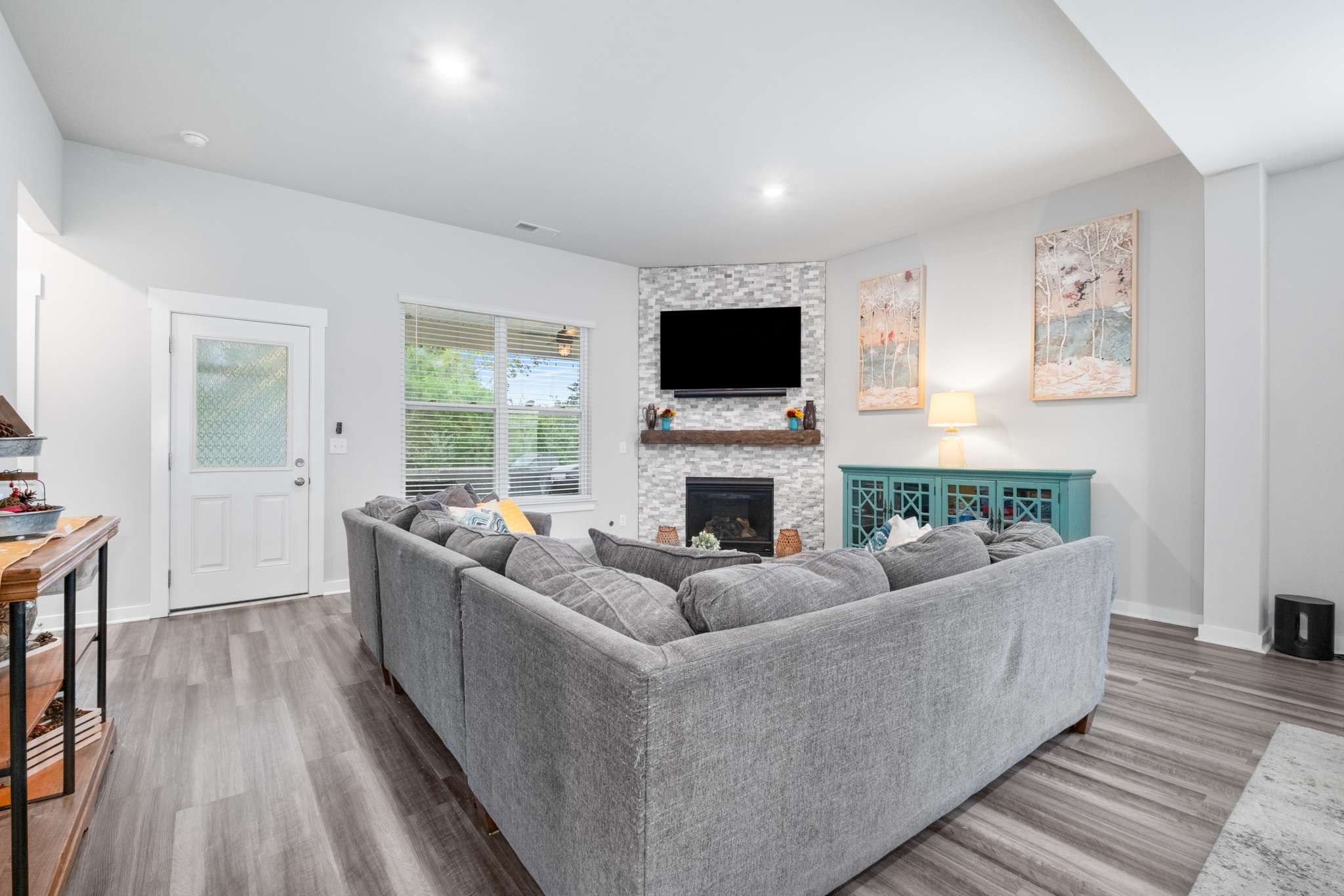 3122 Rift Lane Murfreesboro, TN 37130 - Photo 6 of 55 a living room with furniture a flat screen tv and a fireplace