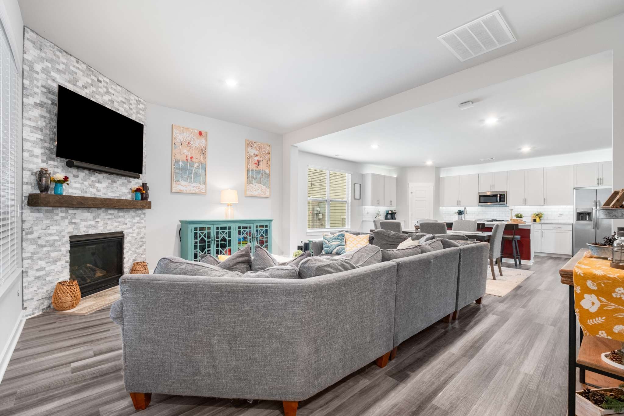 3122 Rift Lane Murfreesboro, TN 37130 - Photo 7 of 55 a living room with furniture a fireplace and a flat screen tv