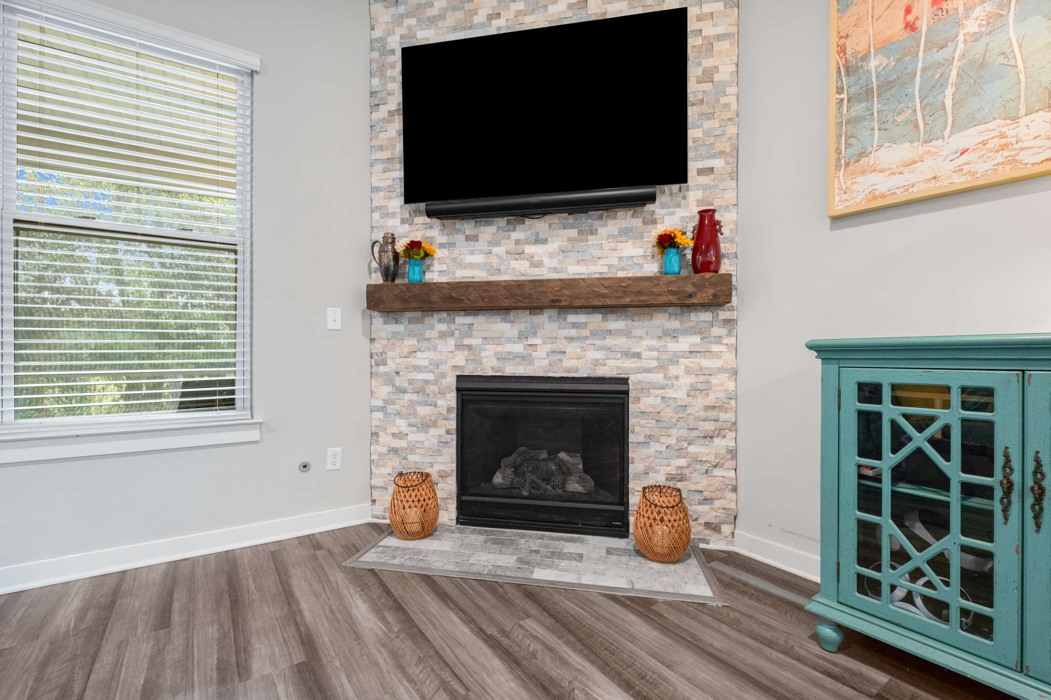 3122 Rift Lane Murfreesboro, TN 37130 - Photo 8 of 55 a living room with a fireplace a flat screen tv and a window