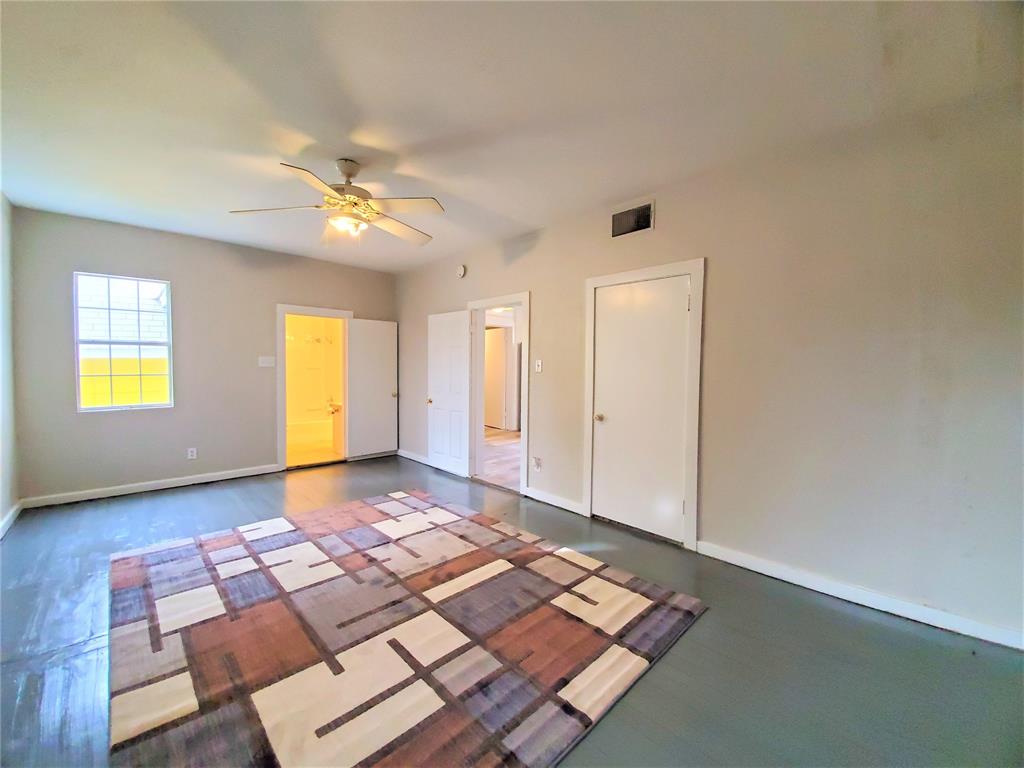 2223 North Locust Street Denton, TX 76209 - Photo 17 of 33 a view of an empty room with window and chandelier fan