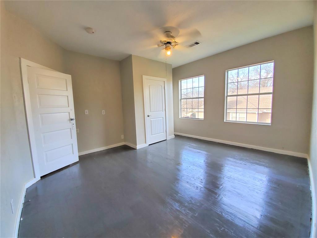 2223 North Locust Street Denton, TX 76209 - Photo 25 of 33 an empty room with wooden floor and window