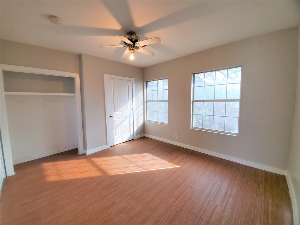 2223 North Locust Street Denton, TX 76209 - Photo 27 of 33 a view of an empty room with a window and wooden floor