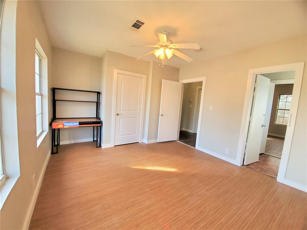 2223 North Locust Street Denton, TX 76209 - Photo 31 of 33 a view of an empty room with wooden floor and a window