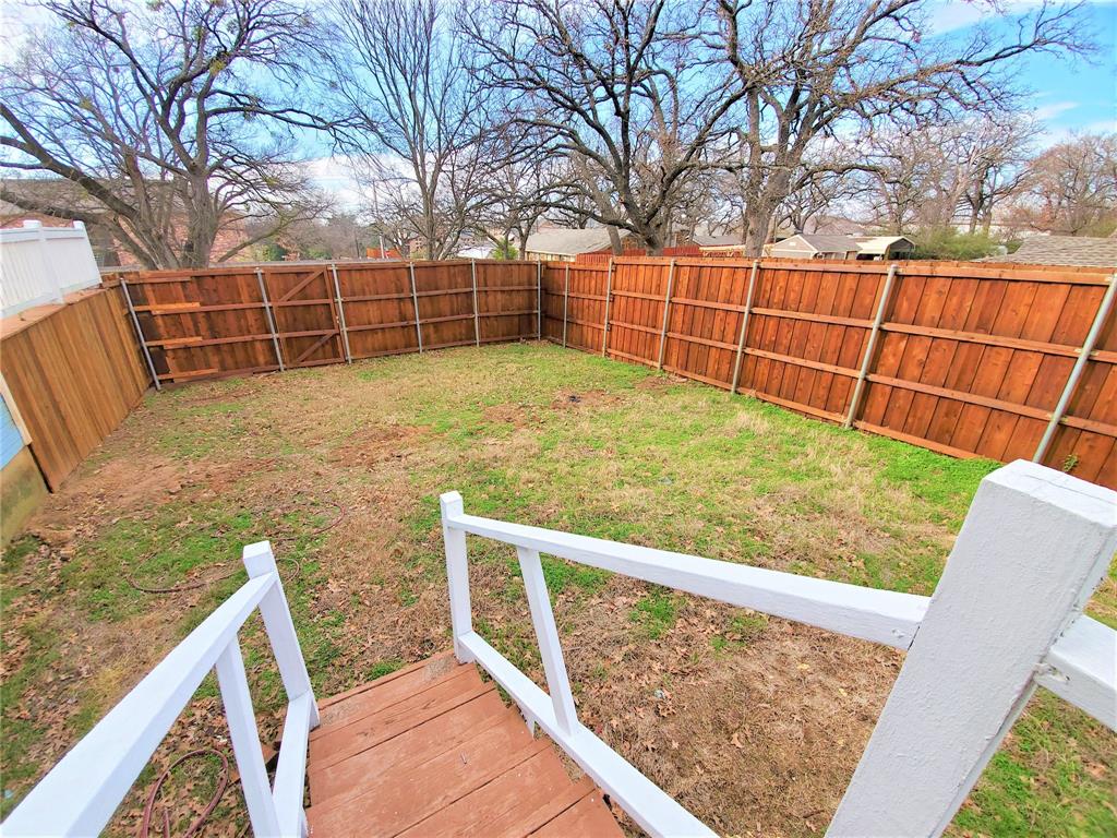 2223 North Locust Street Denton, TX 76209 - Photo 32 of 33 a view of a backyard with iron fence