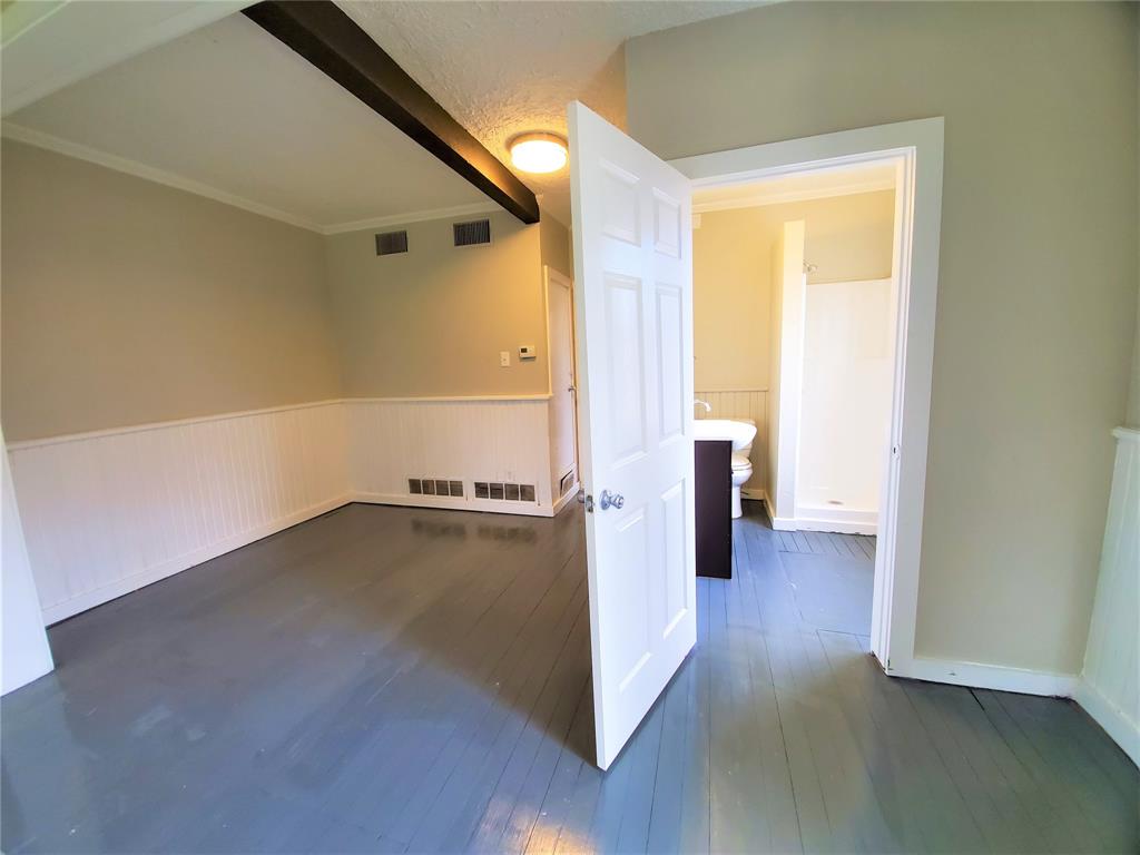 2223 North Locust Street Denton, TX 76209 - Photo 10 of 33 a view of a room with wooden floor