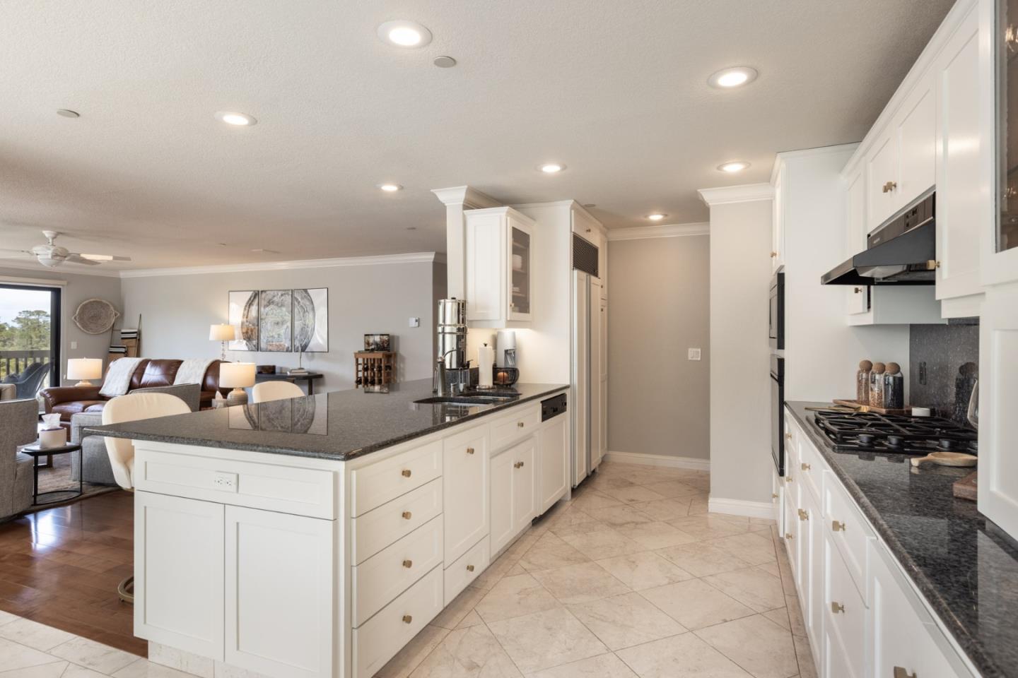 a kitchen with counter top space a sink stainless steel appliances and cabinets