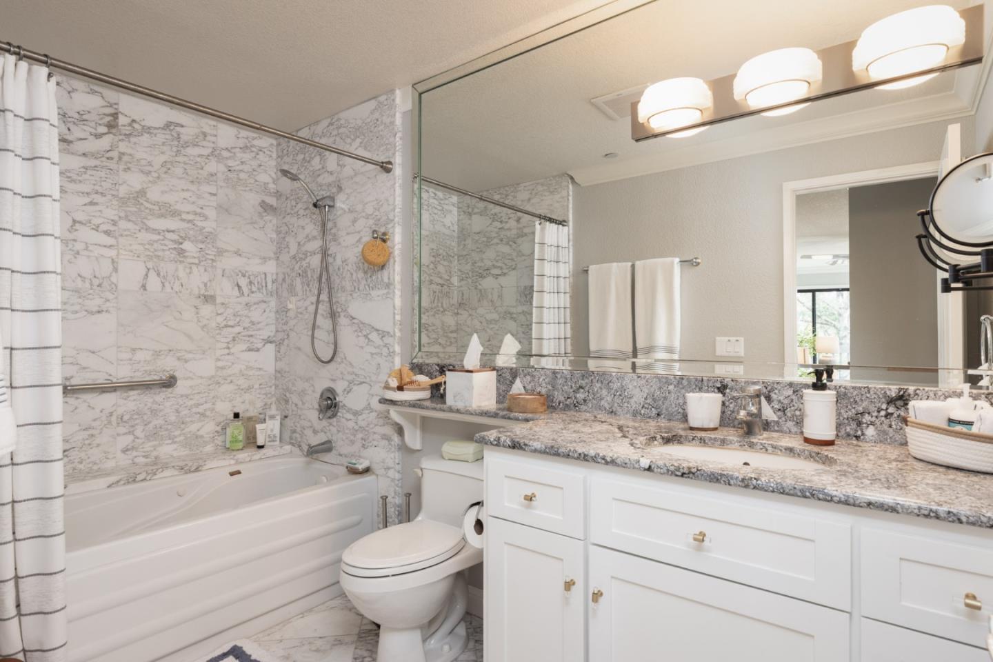 20 Shepherd's Knoll Pebble Beach, CA 93953 - Photo 20 of 23 a bathroom with a granite countertop sink a toilet and bathtub