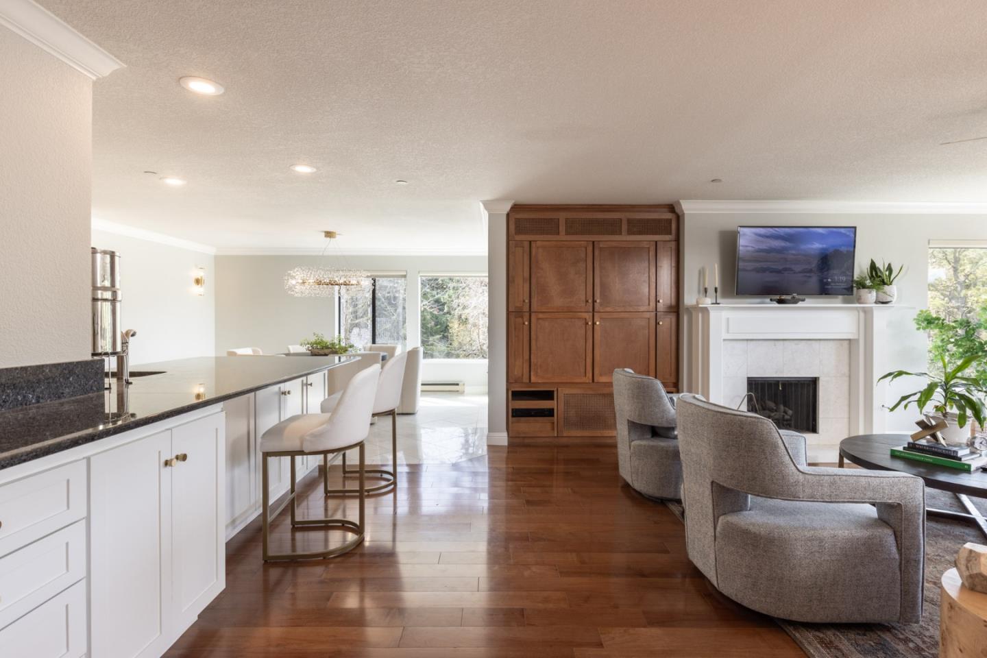 20 Shepherd's Knoll Pebble Beach, CA 93953 - Photo 4 of 23 a living room with furniture a fireplace and a flat screen tv