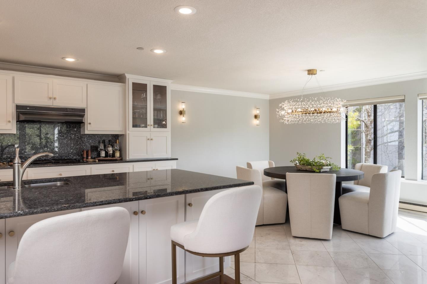 20 Shepherd's Knoll Pebble Beach, CA 93953 - Photo 5 of 23 a kitchen with a table chairs a sink and a counter top space