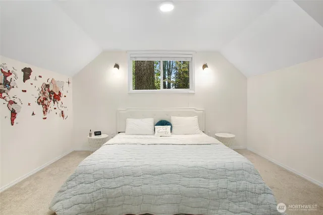 a large white bed in a white room