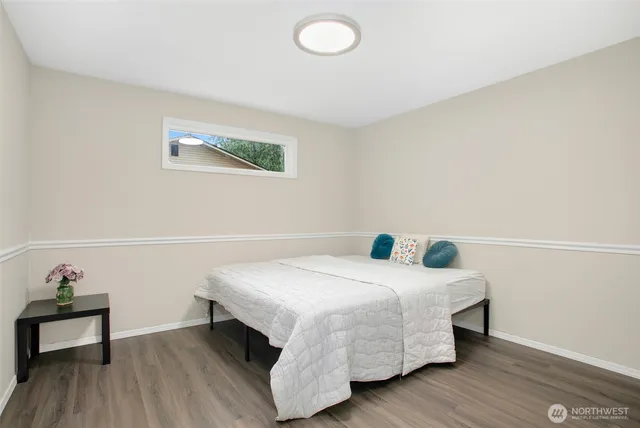 a bedroom with a bed and a table