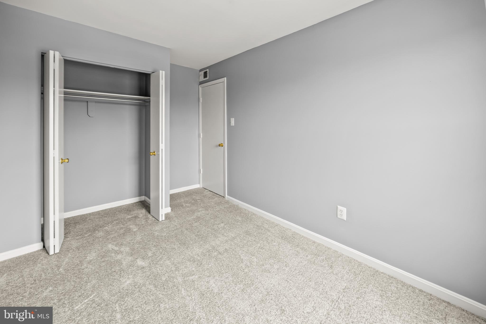 6 Normandy Square Court, Unit 2CF Silver Spring, MD 20906 - Photo 11 of 42 a view of an empty room and closet area
