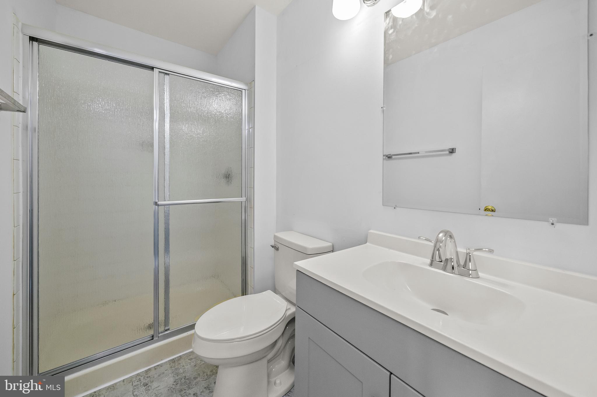 6 Normandy Square Court, Unit 2CF Silver Spring, MD 20906 - Photo 14 of 42 a bathroom with a sink toilet and shower
