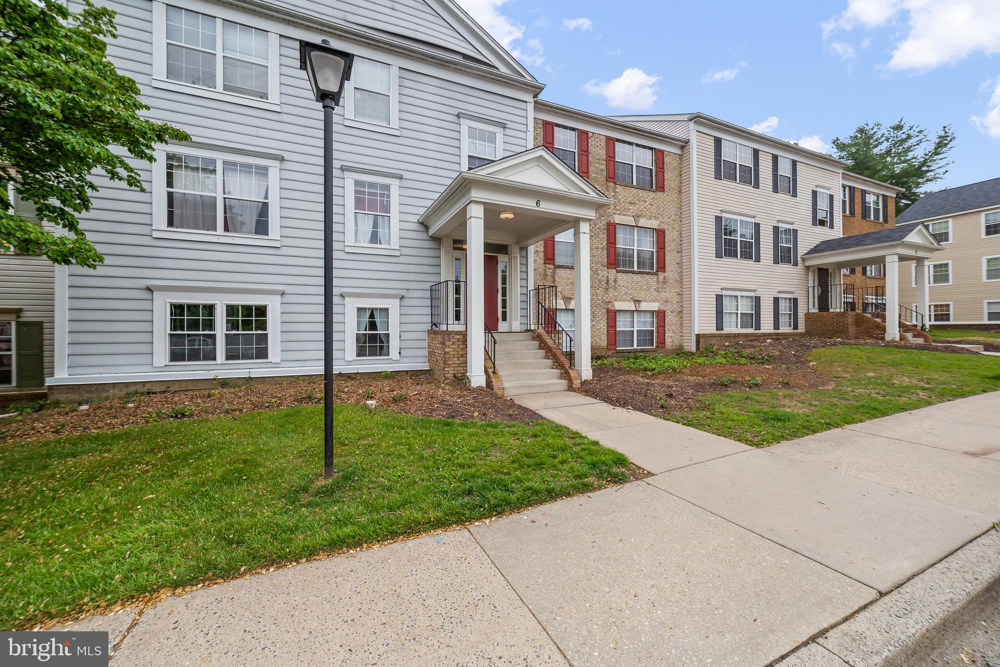 6 Normandy Square Court, Unit 2CF Silver Spring, MD 20906 - Photo 2 of 42 a view of a brick house with a yard
