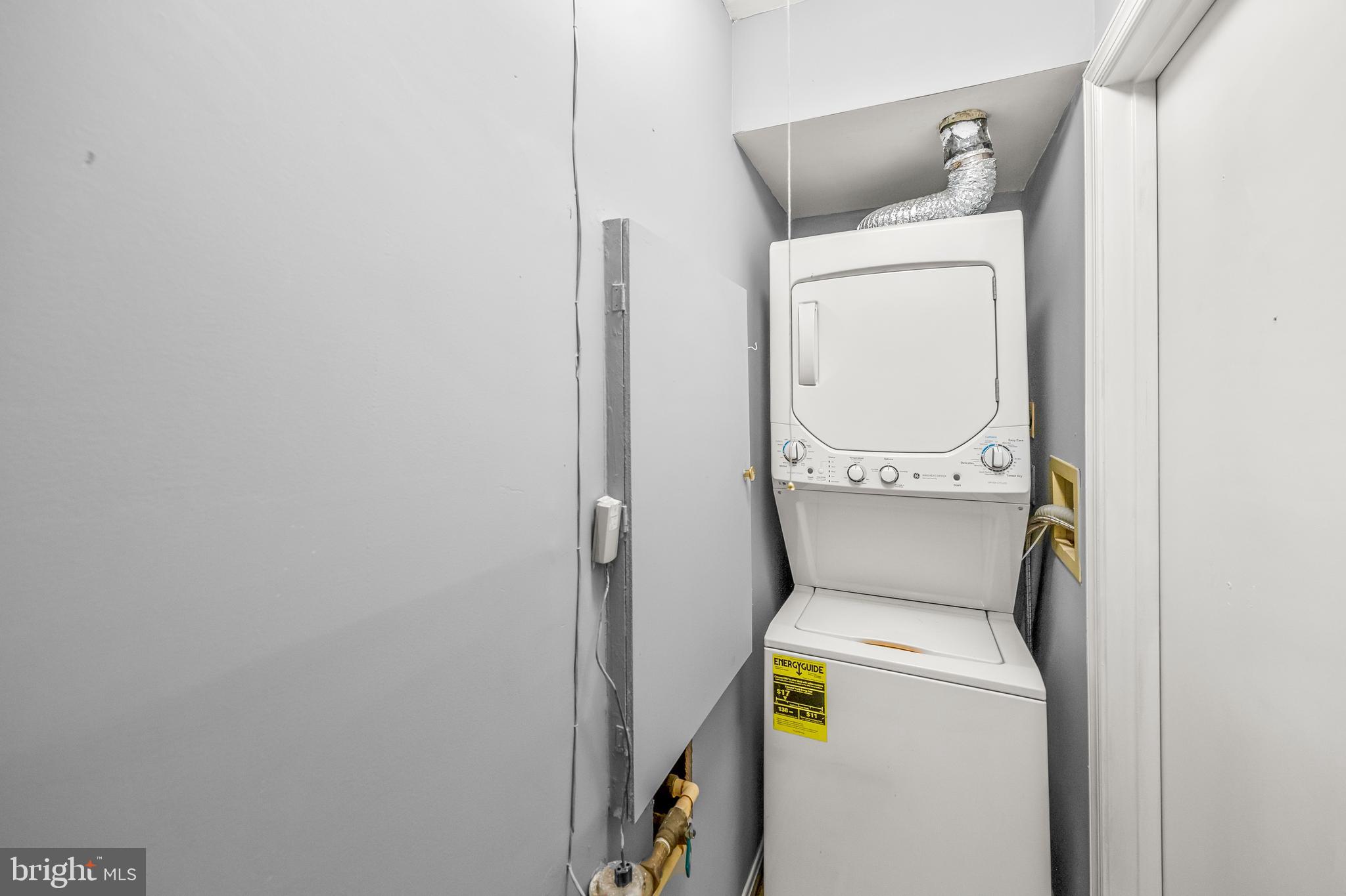 6 Normandy Square Court, Unit 2CF Silver Spring, MD 20906 - Photo 23 of 42 a utility room with dryer and washer