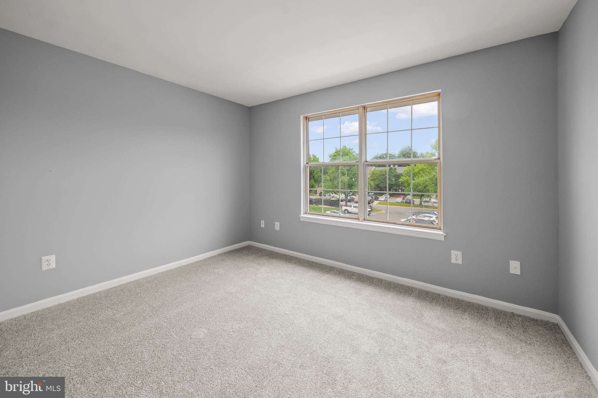 6 Normandy Square Court, Unit 2CF Silver Spring, MD 20906 - Photo 28 of 42 an empty room with windows