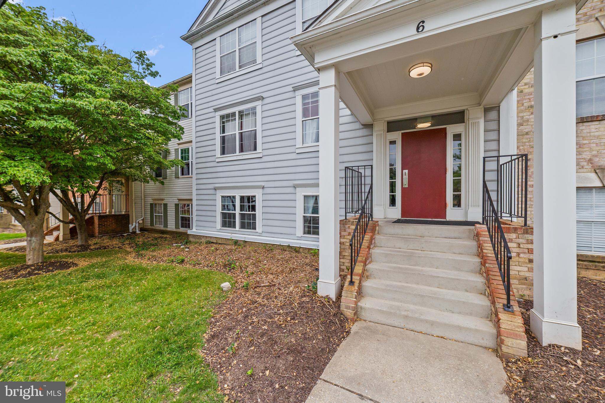 6 Normandy Square Court, Unit 2CF Silver Spring, MD 20906 - Photo 3 of 42 a front view of a house with a yard