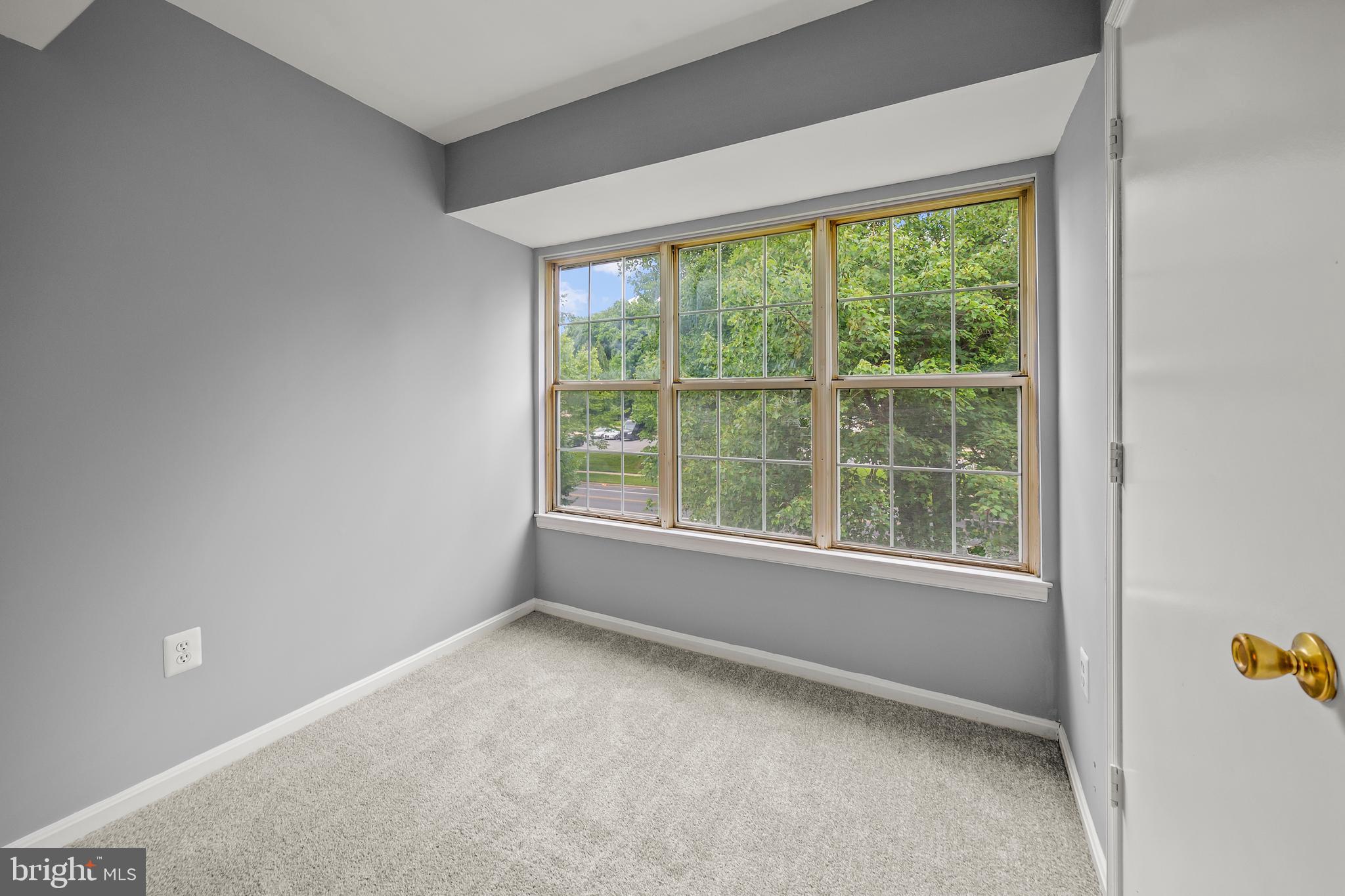 6 Normandy Square Court, Unit 2CF Silver Spring, MD 20906 - Photo 32 of 42 an empty room with a window