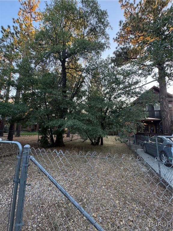 a view of a backyard with table and chairs