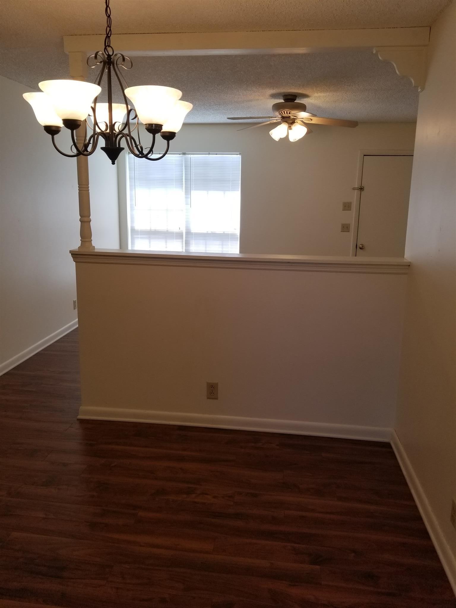 3116 Stoneybrook Circle Antioch, TN 37013 - Photo 3 of 13 a view of a chandelier fan and wooden floor