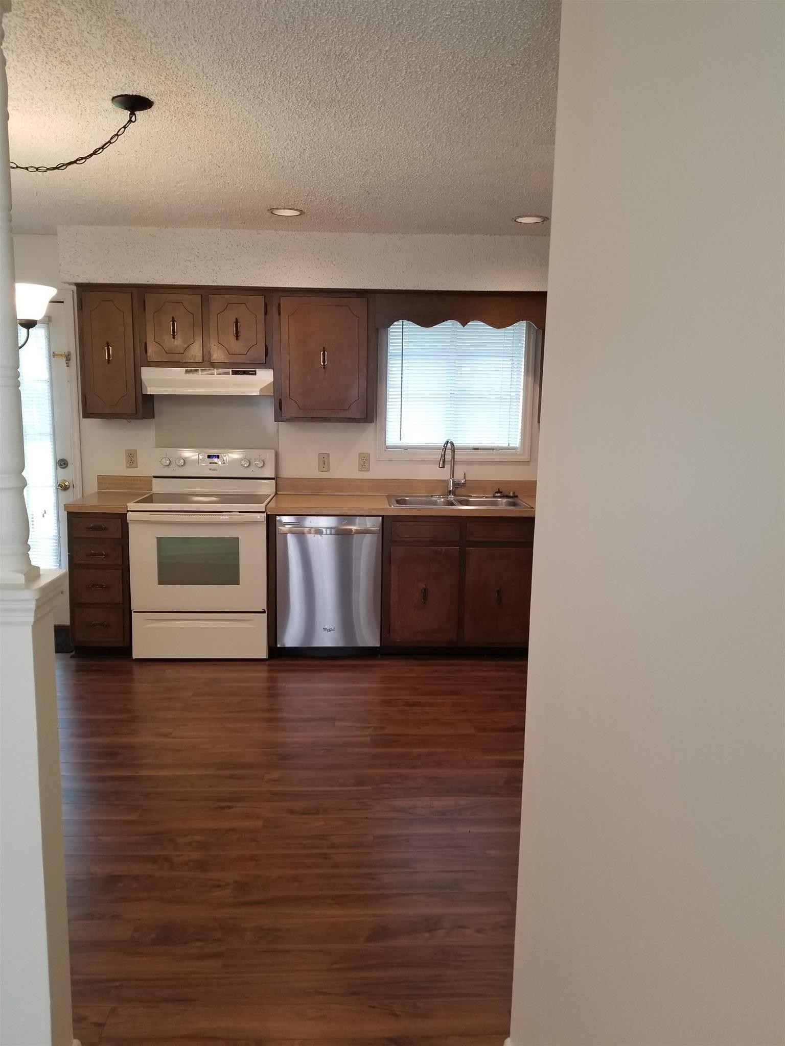 3116 Stoneybrook Circle Antioch, TN 37013 - Photo 4 of 13 a kitchen with stainless steel appliances granite countertop a stove and a sink