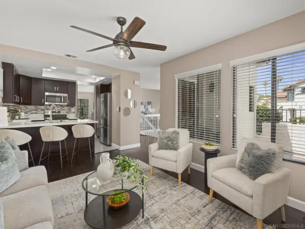 a living room with furniture and a large window