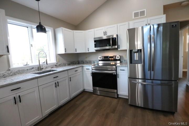 3218 Rte 9W, Unit 1 Saugerties, NY 12477 - Photo 13 of 13 a kitchen with stainless steel appliances a refrigerator sink and microwave