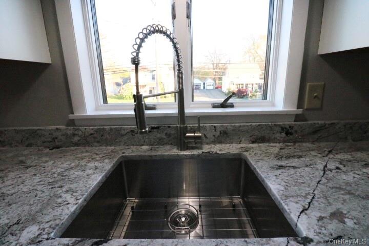 3218 Rte 9W, Unit 1 Saugerties, NY 12477 - Photo 5 of 13 a kitchen with a sink a counter top space and a window