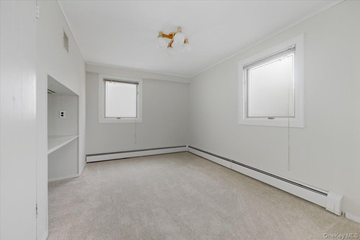 930 Jewel Drive Valley Stream, NY 11581 - Photo 13 of 32 an empty room with a window