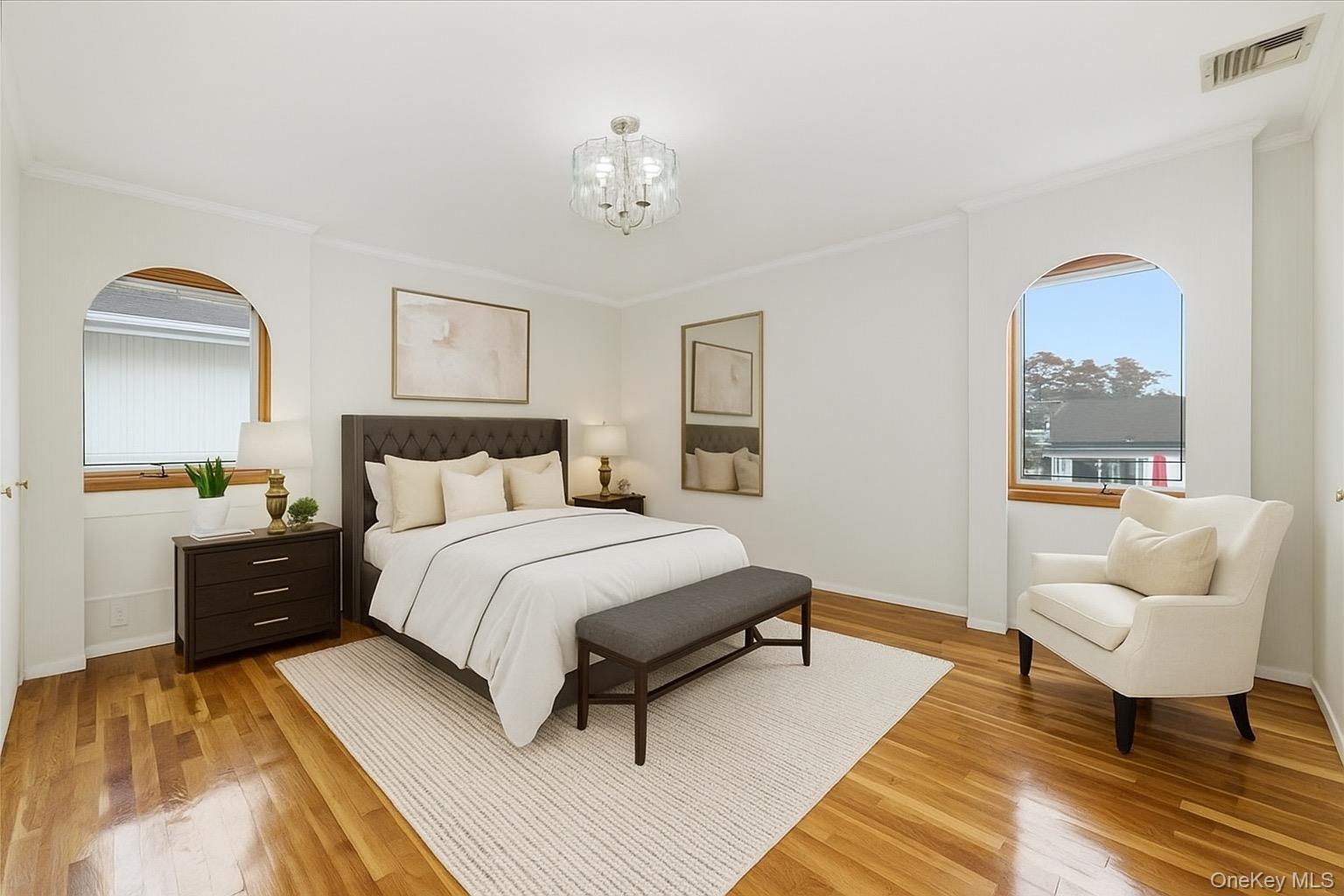 930 Jewel Drive Valley Stream, NY 11581 - Photo 16 of 32 a bedroom with a bed and wooden floor