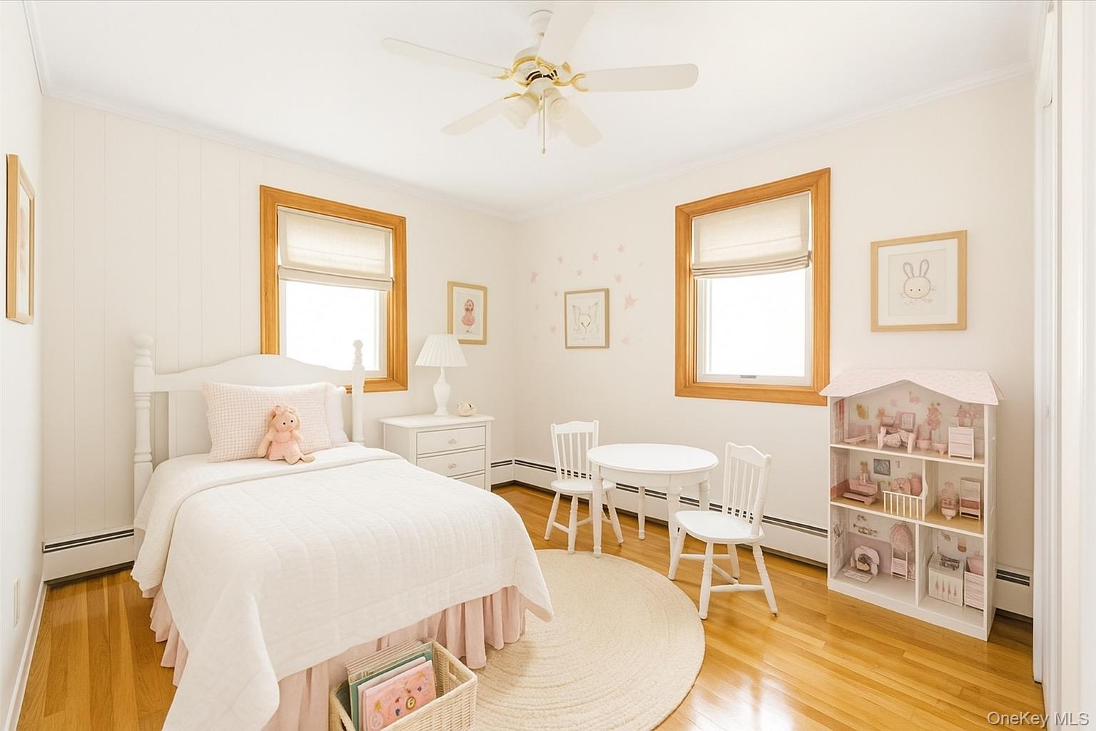 930 Jewel Drive Valley Stream, NY 11581 - Photo 18 of 32 a bedroom with a bed and wooden floor
