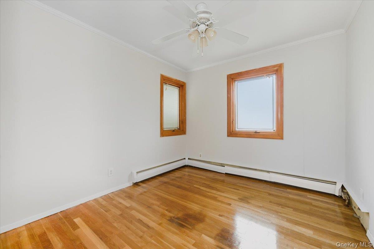 930 Jewel Drive Valley Stream, NY 11581 - Photo 21 of 32 a view of empty room with wooden floor