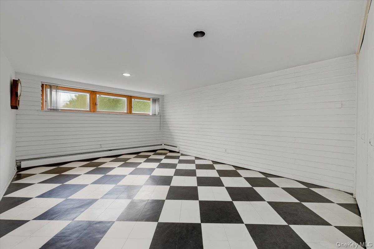 930 Jewel Drive Valley Stream, NY 11581 - Photo 24 of 32 a black and white checkered floor