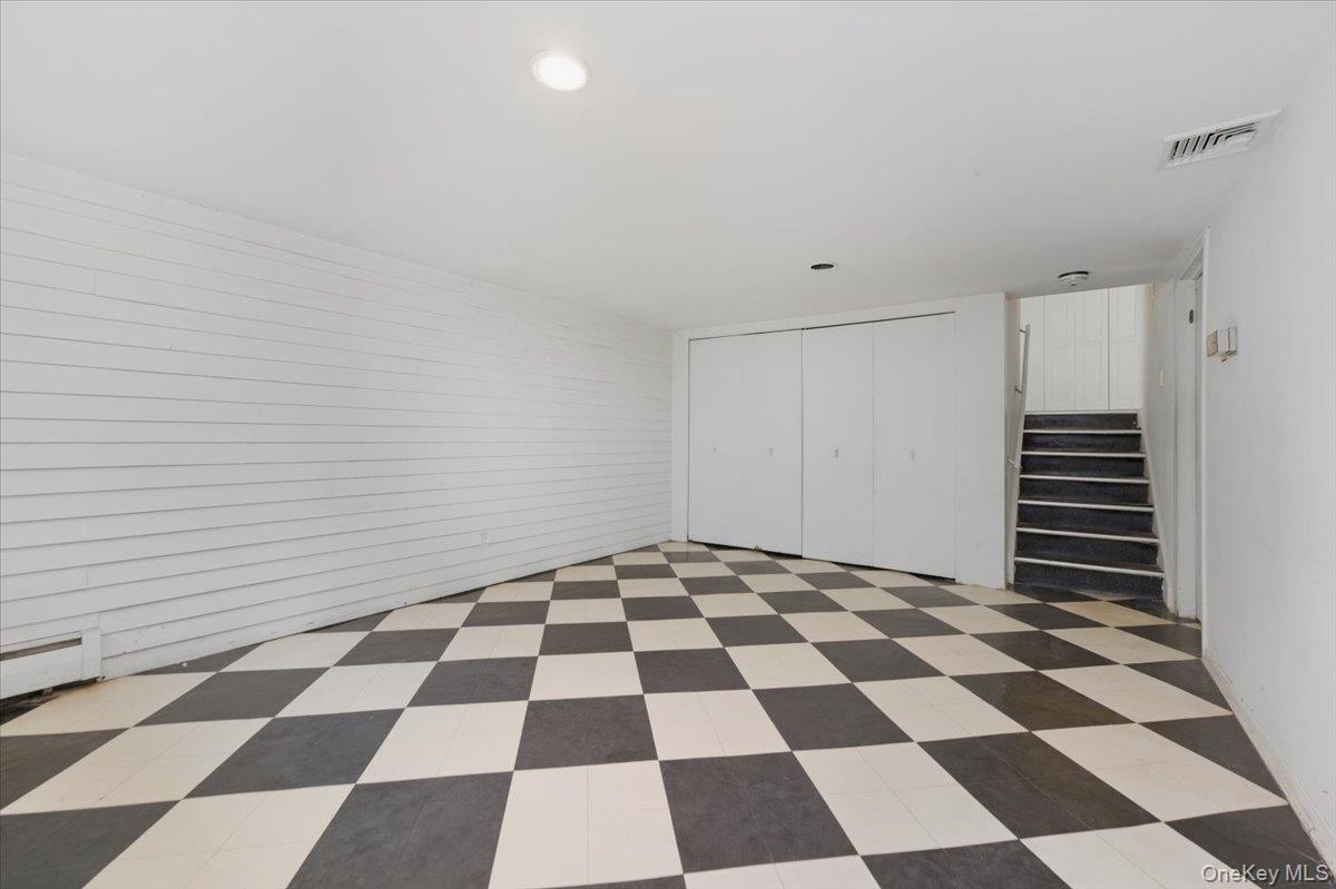 930 Jewel Drive Valley Stream, NY 11581 - Photo 25 of 32 a black and white checkered floor