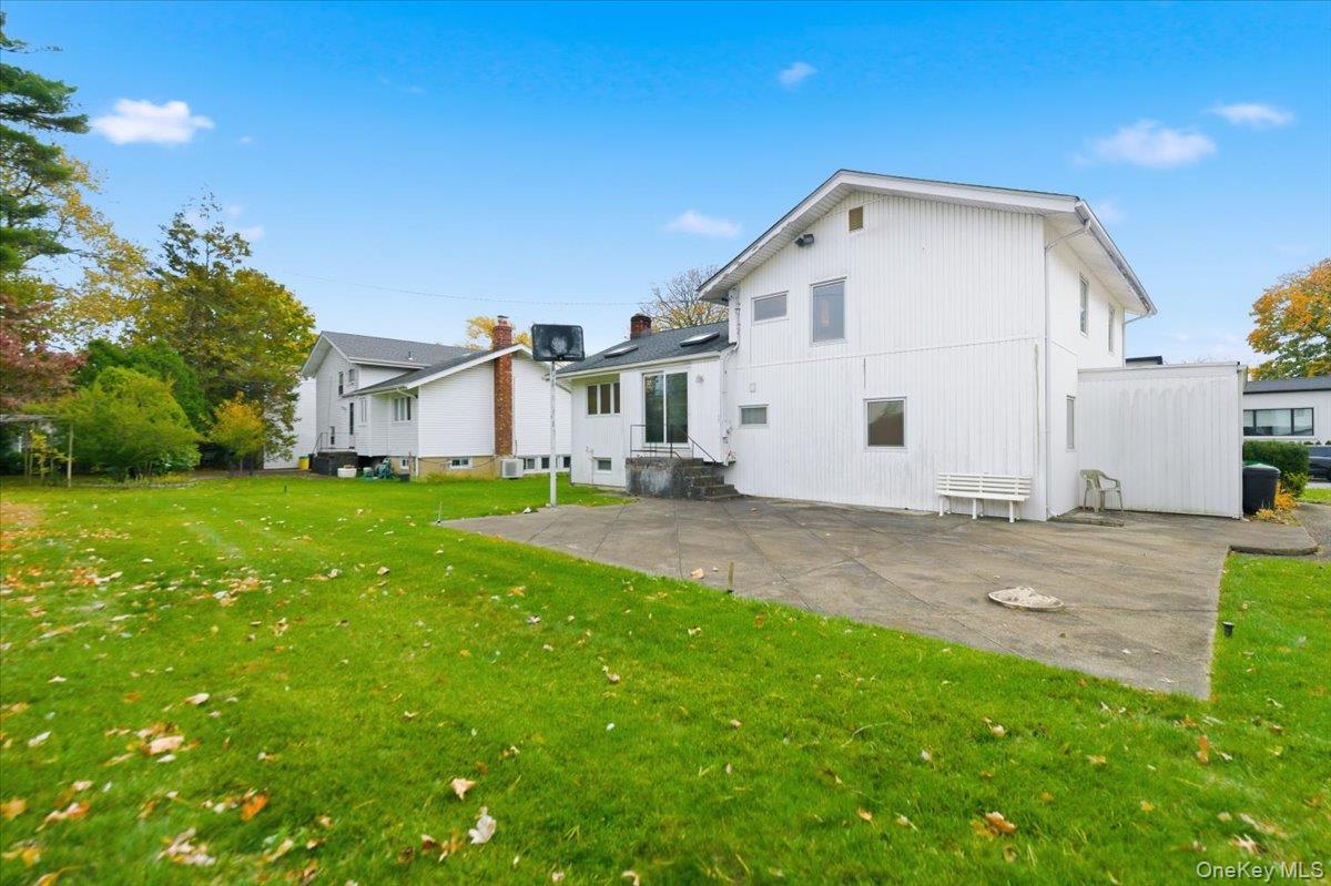 930 Jewel Drive Valley Stream, NY 11581 - Photo 27 of 32 a front view of a house with a yard
