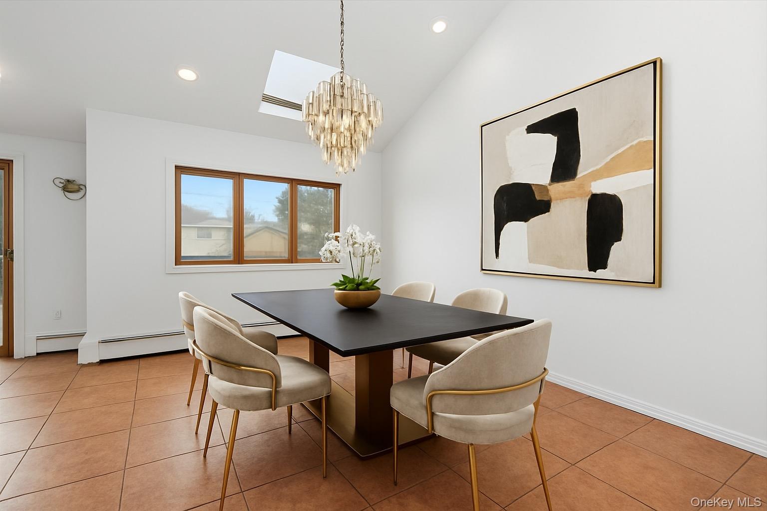930 Jewel Drive Valley Stream, NY 11581 - Photo 8 of 32 a view of a dining room with furniture and chandelier