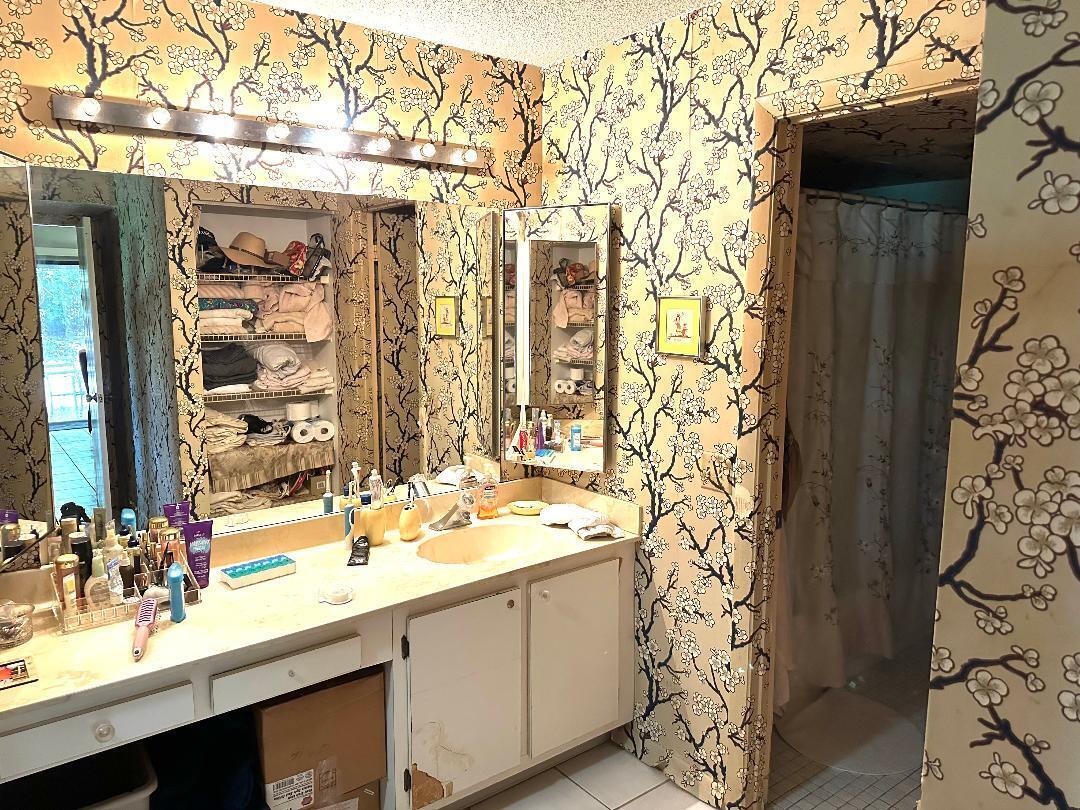 21848 Arriba Real, Unit A Boca Raton, FL 33433 - Photo 6 of 10 a bathroom with a sink and a mirror