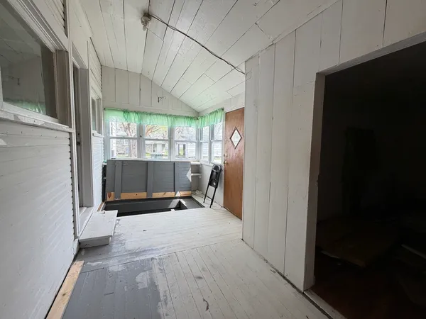 a view of a room with a large window