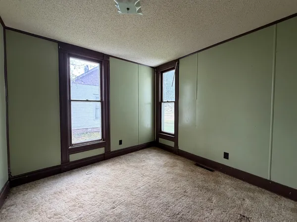 an empty room with windows