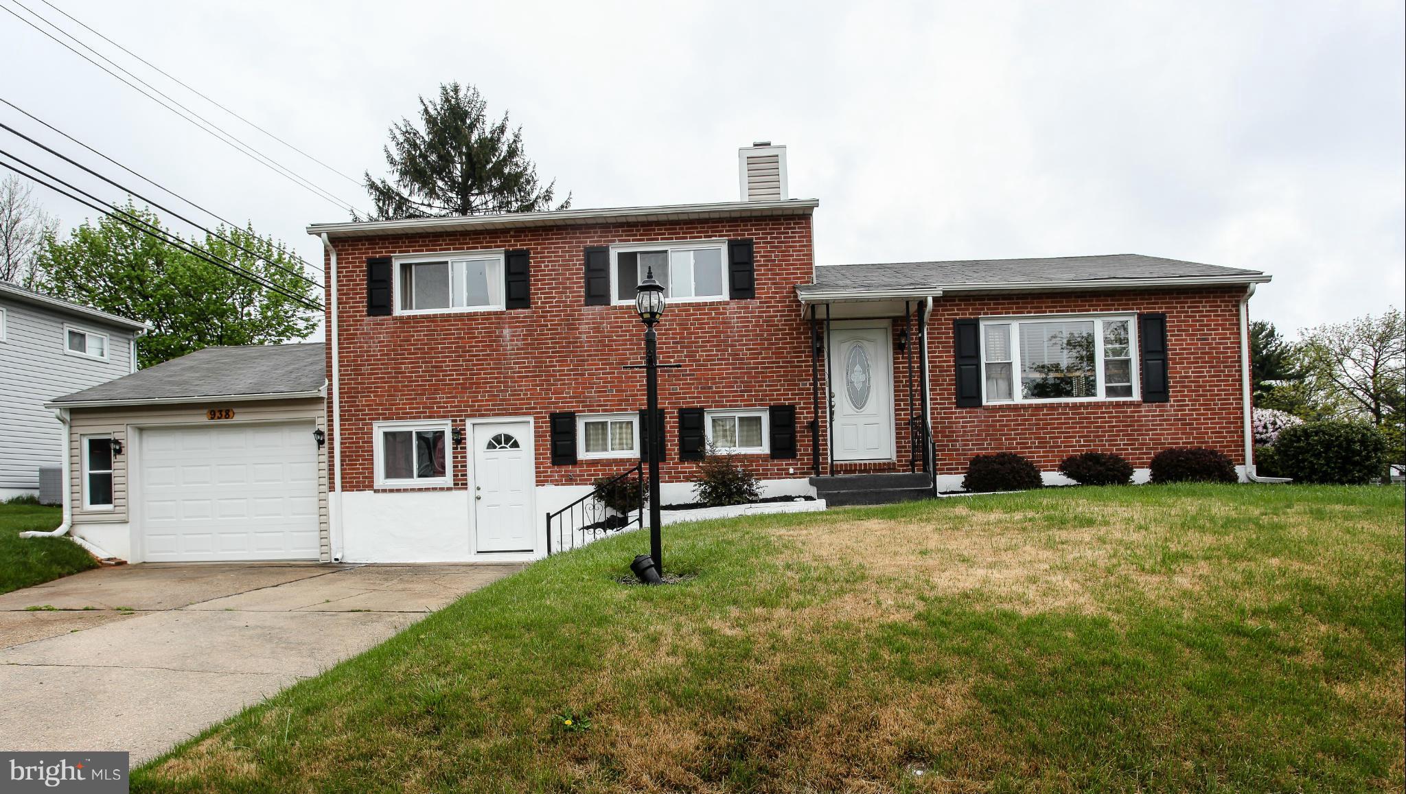 938 Vanderwood Road Baltimore, MD 21228 - Photo 1 of 26 front view of a house with a yard