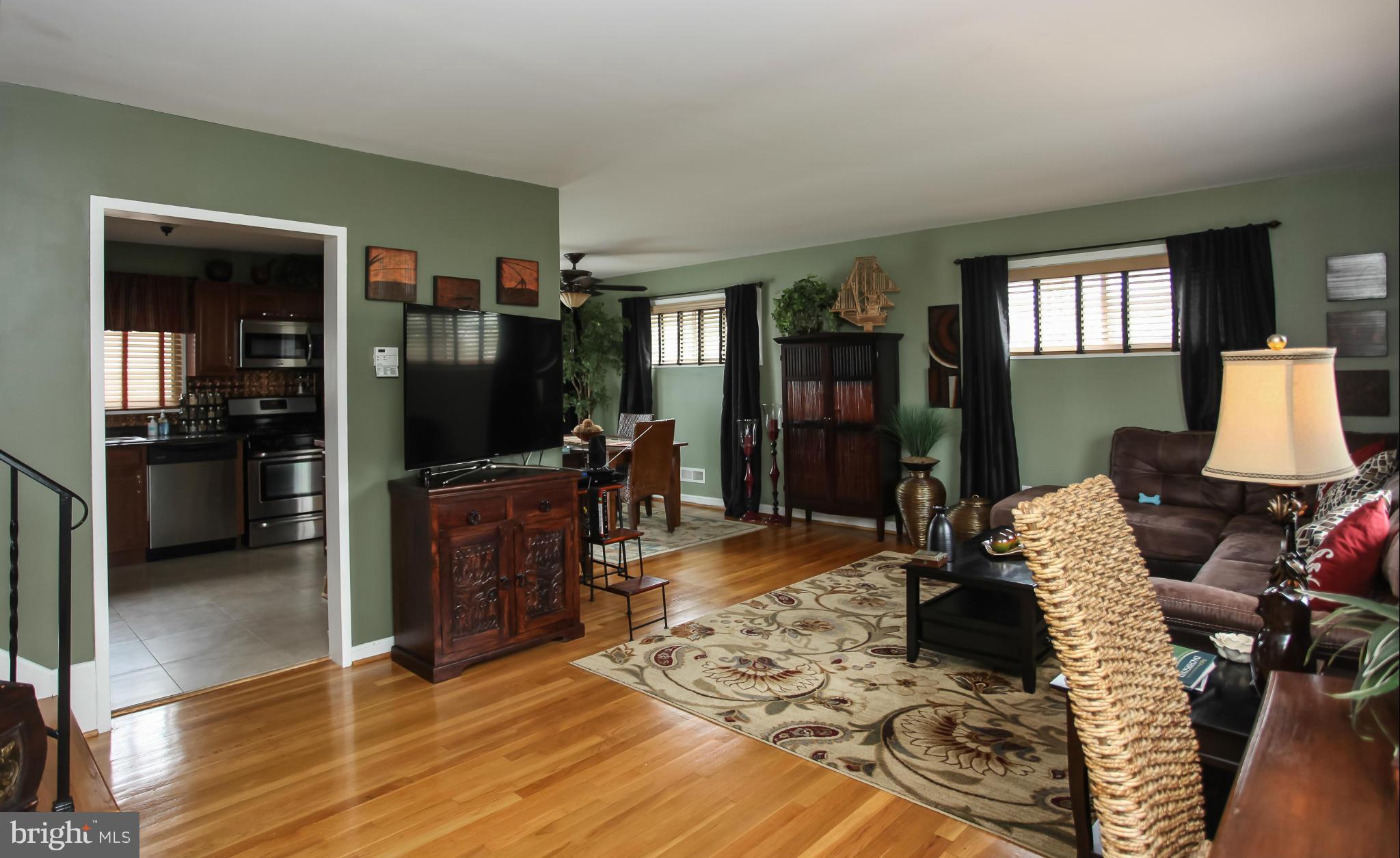 938 Vanderwood Road Baltimore, MD 21228 - Photo 2 of 26 a living room with furniture and a flat screen tv