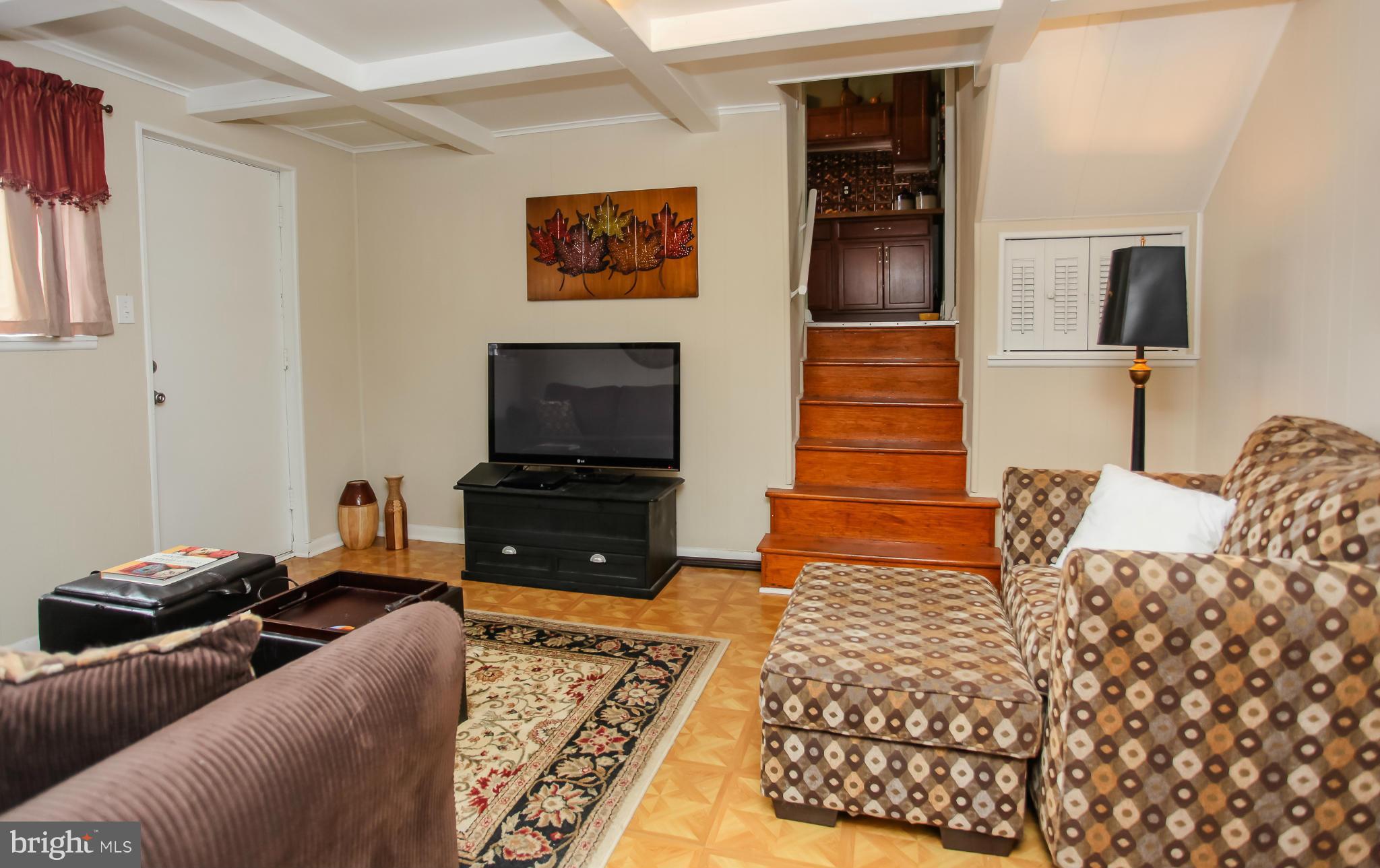 938 Vanderwood Road Baltimore, MD 21228 - Photo 12 of 26 a living room with furniture and a flat screen tv