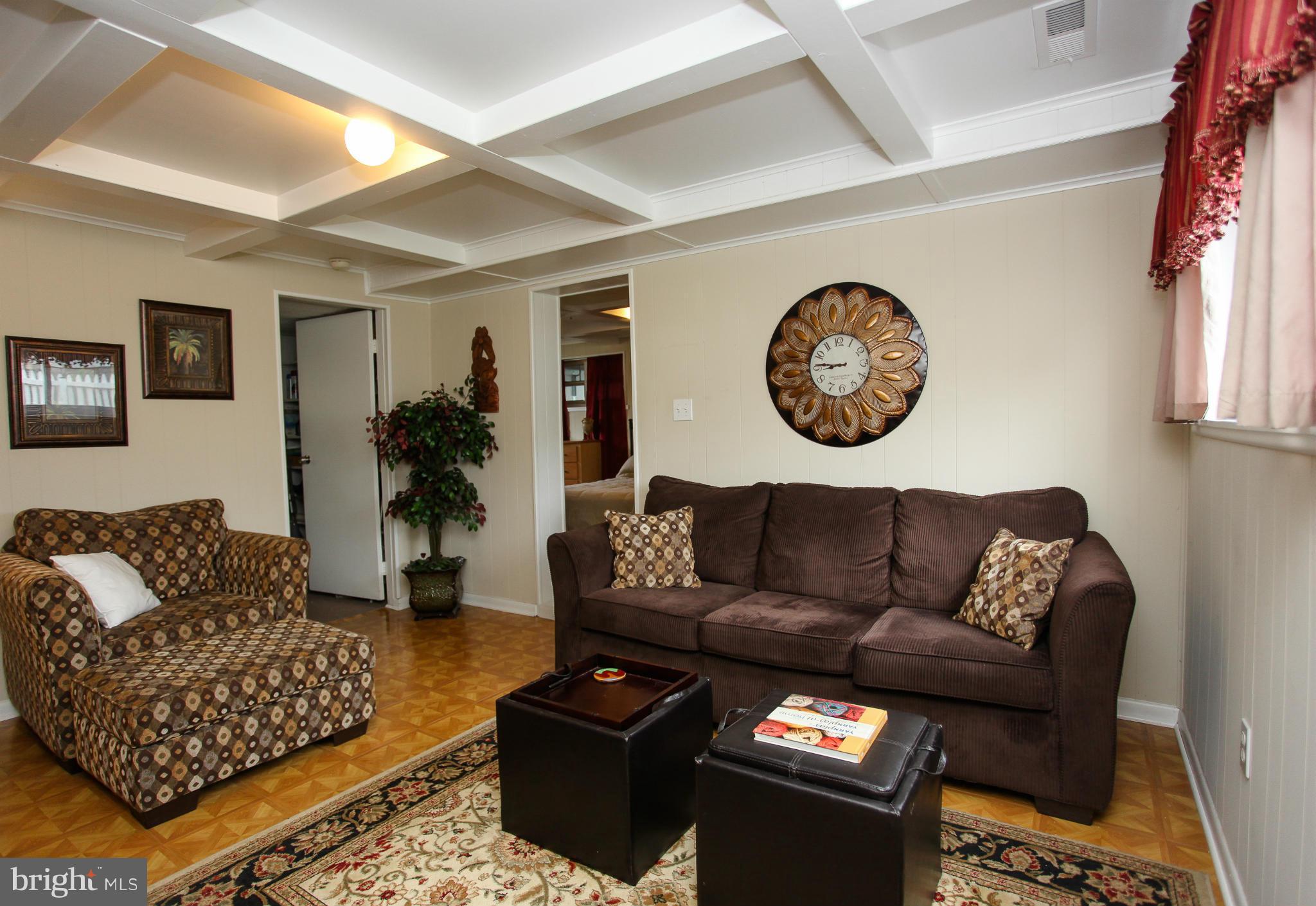938 Vanderwood Road Baltimore, MD 21228 - Photo 14 of 26 a living room with furniture and a rug